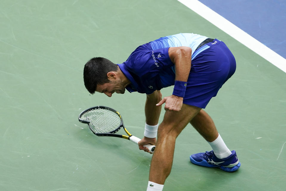 Novak Djokovic, of Serbia, smashes his racket on the court after losing a point to Daniil Medvedev, of Russia, during the men's singles final of the US Open tennis championships, Sunday, Sept. 12, 2021, in New York. (AP Photo/Seth Wenig)