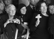 <p>Greek Orthodox pilgrims stand prepared to witness the Good Friday procession led by Greek Orthodox Patriarch Diodoros I, inside the Church of the Holy Sepulcher, traditionally believed to be the site of Jesus Christ’s crucifixion and burial, April 16, 1993, in Jerusalem’s Old City. (Photo: Jacqueline Larma/AP) </p>