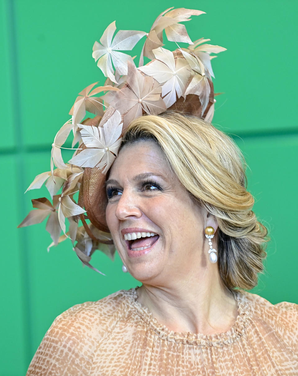 Queen Maxima of the Netherlands laughs during a meeting with Wolfgang Schaeuble, the President of the Bundestag, the lower house of parliament, at the parliament in Berlin, Germany, July 6, 2021. The Dutch royal couple is on a state visit to Germany until July 7, 2021. (Tobias Schwarz/AP via Pool)