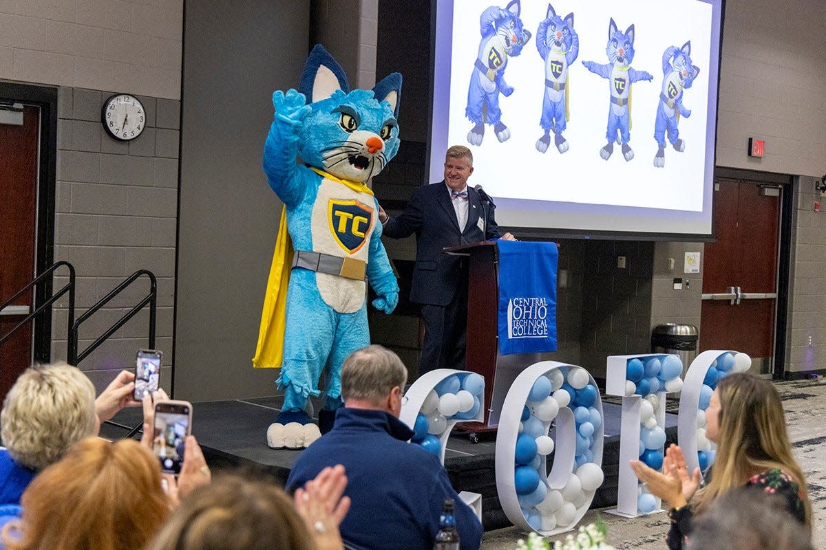 Central Ohio Technical College President John Berry introduces the school's new mascot, TC the Cat, which is short for Catalyst.