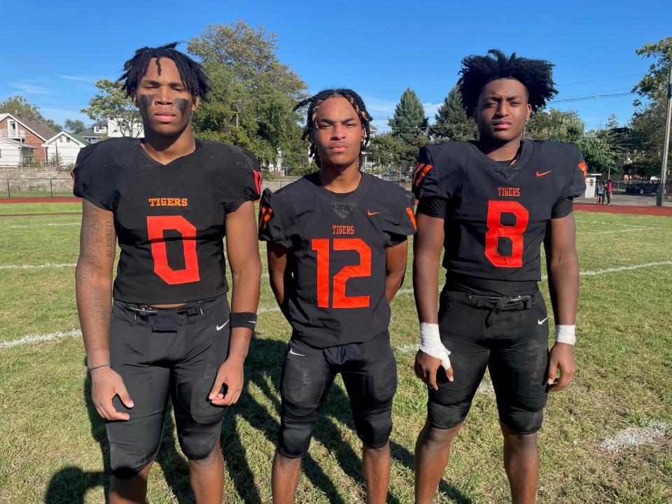 Eastside's Fatim Diggs, left, Nazir Flack, center, and Elijah Satchell helped the Tigers take down Cedar Creek 26-8 on Saturday, Sept., 16, 2023.