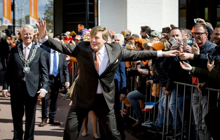 Dutch King Willem-Alexander gestures as he celebrates his 50th birthday on the traditional King's Day (Koningsdag) in the southern city of Tilburg