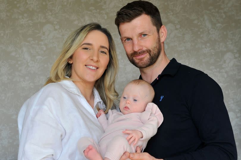 Baby Polly with mum Chloe and dad David