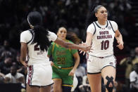 South Carolina center Kamilla Cardoso (10) shakes hands with guard Bree Hall (23) during the second half of an NCAA college basketball game Notre Dame Monday, Nov. 6, 2023, in Paris. (AP Photo/Thibault Camus)
