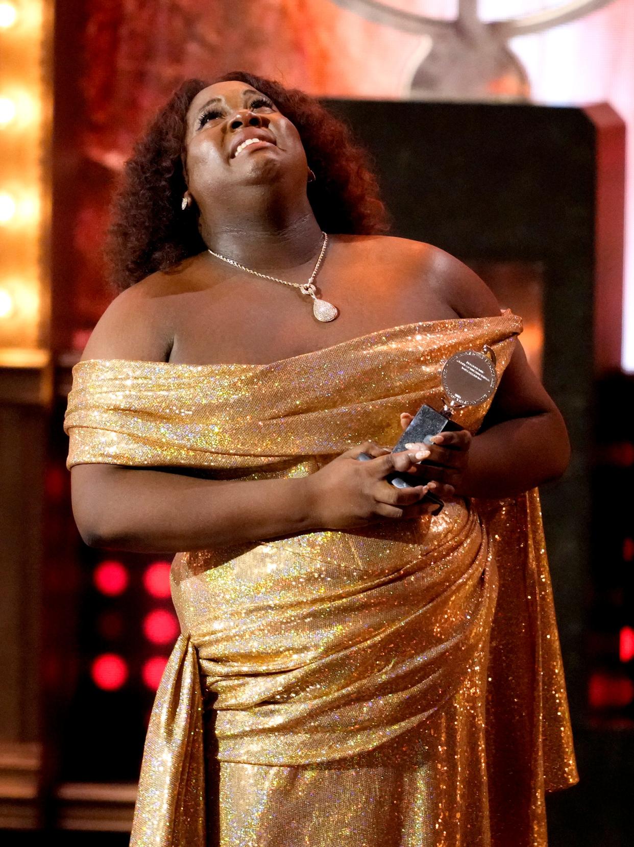 Alex Newell accepts the award for best performance by an actor in a featured role in a musical for "Shucked."