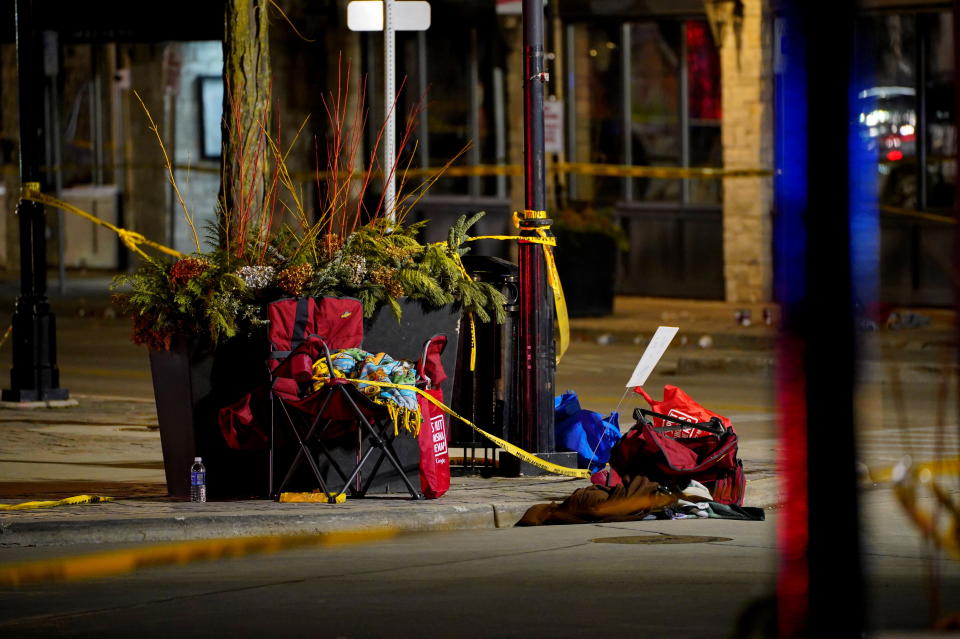 Chairs are left abandoned after a car plowed through a holiday parade in Waukesha, Wis., on Sunday.