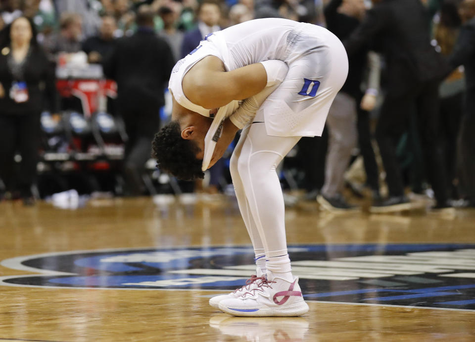 Duke guard Tre Jones covers his face after losing to Michigan State in the NCAA men's East Regional final college basketball game in Washington, Sunday, March 31, 2019. Michigan State won 68-67. (AP Photo/Alex Brandon)