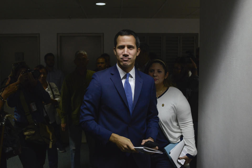 Opposition leader Juan Guaido arrives for a press conference in Caracas, Venezuela, Monday, Jan. 6, 2020. Guaido was expected to be reelected head of the opposition-dominated legislature the previous day, but security forces blocked him and other opposition lawmakers from entering the session where lawmakers loyal to President Nicolas Maduro rushed to choose a substitute leader from a small faction of opposition deputies recently banished for allegedly taking government bribes.(AP Photo/Matias Delacroix)