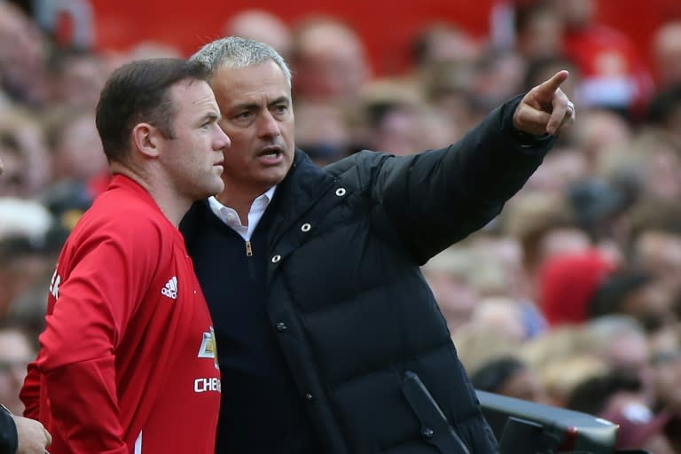 Manchester United manager Jose Mourinho (R) has not picked Wayne Rooney (L) to start in the last four games and the England striker has also seen his place in the national team disappear 