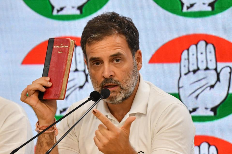 Rahul Gandhi with his copy of the Indian constitution at the Congress party headquarters in New Delhi (AFP via Getty)