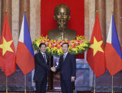 Philippine President Ferdinand Marcos Jr., left, and Vietnamese President Vo Van Thuong shake hands before a meeting in Hanoi, Vietnam Tuesday, Jan.30, 2024. Marcos is on a visit to Hanoi to boost the bilateral relation with the fellow Southeast Asian nation. (Hoang Thong Nhat/VNA via AP)