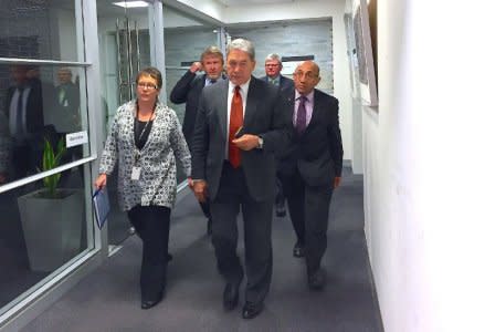 Winston Peters, leader of the New Zealand First Party, walks with officials to a meeting in Wellington, New Zealand, October 8, 2017. REUTERS/Charlotte Greenfield