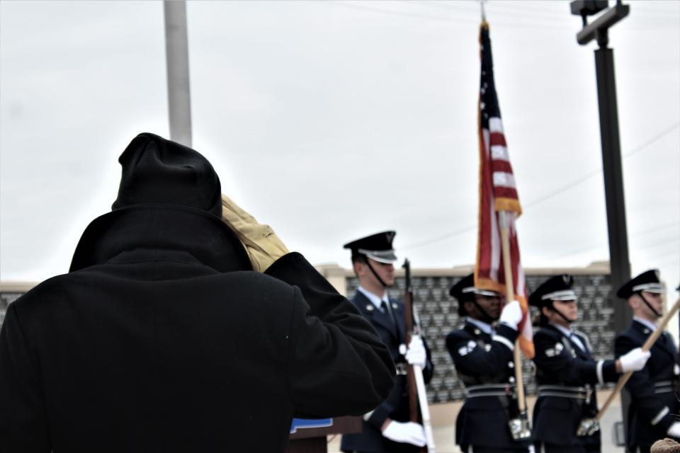 A Montana Veterans Memorial volunteer salutes the U.S. flag.