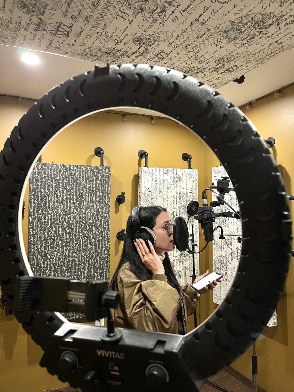 Lorenna Gomes records music in the Hudson studio of Efrain Quiles, Oct. 6, 2022.