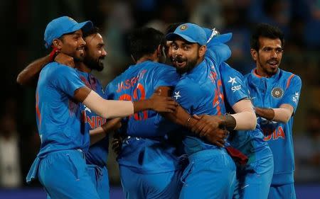 Cricket - India v England - Third T20 International - M Chinnaswamy Stadium, Bengaluru, India - 01/02/17. India's captain Virat Kohli (3rd R) celebrates with team mates after winning the match. REUTERS/Danish Siddiqui