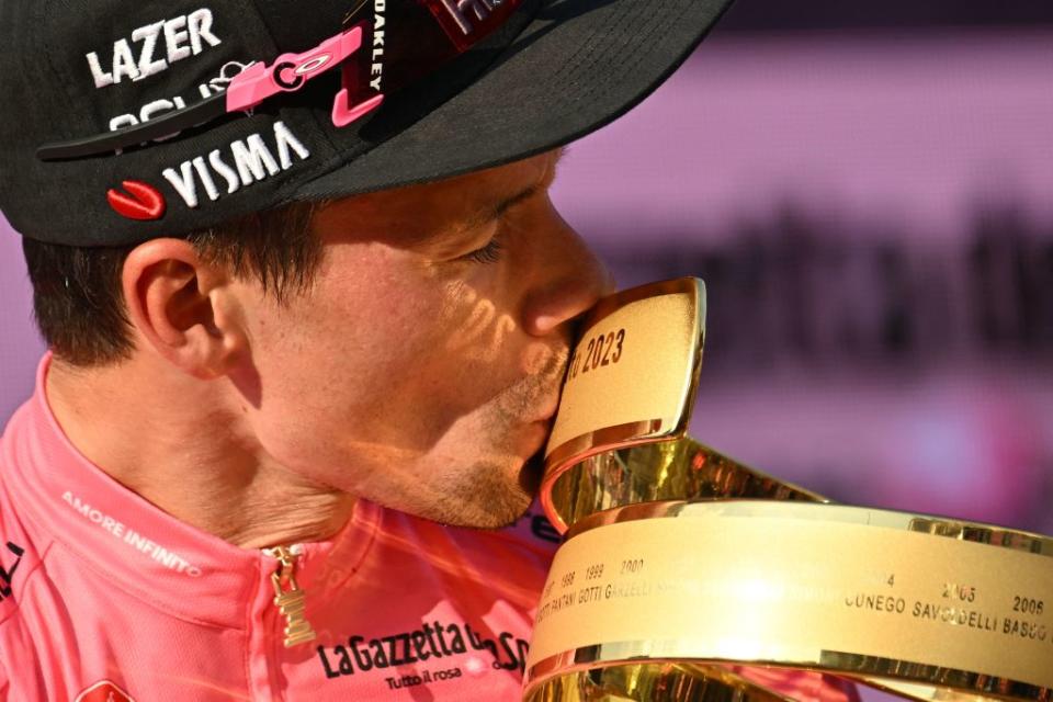 JumboVismas Slovenian rider Primoz Roglic kisses the races winners Trofeo Senza Fine Endless Trophy as he celebrates on the podium after winning the Giro dItalia 2023 cycling race in Rome on May 28 2023 Photo by Alberto PIZZOLI  AFP Photo by ALBERTO PIZZOLIAFP via Getty Images
