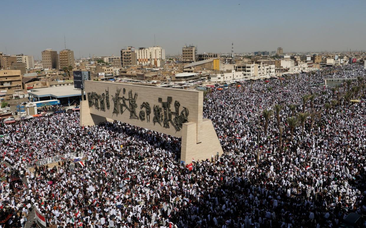 Supporters of Iraqi Shi'ite cleric Moqtada al-Sadr gather during a protest in solidarity with Palestinians in Gaza, in Baghdad, Iraq