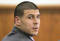 FILE PHOTO: Former New England Patriots player Aaron Hernandez glanced towards the media during his murder trial at Bristol County Superior Court in Fall River, Massachusetts February 3, 2015. REUTERS/Aram Boghosian/The Boston Globe/Pool