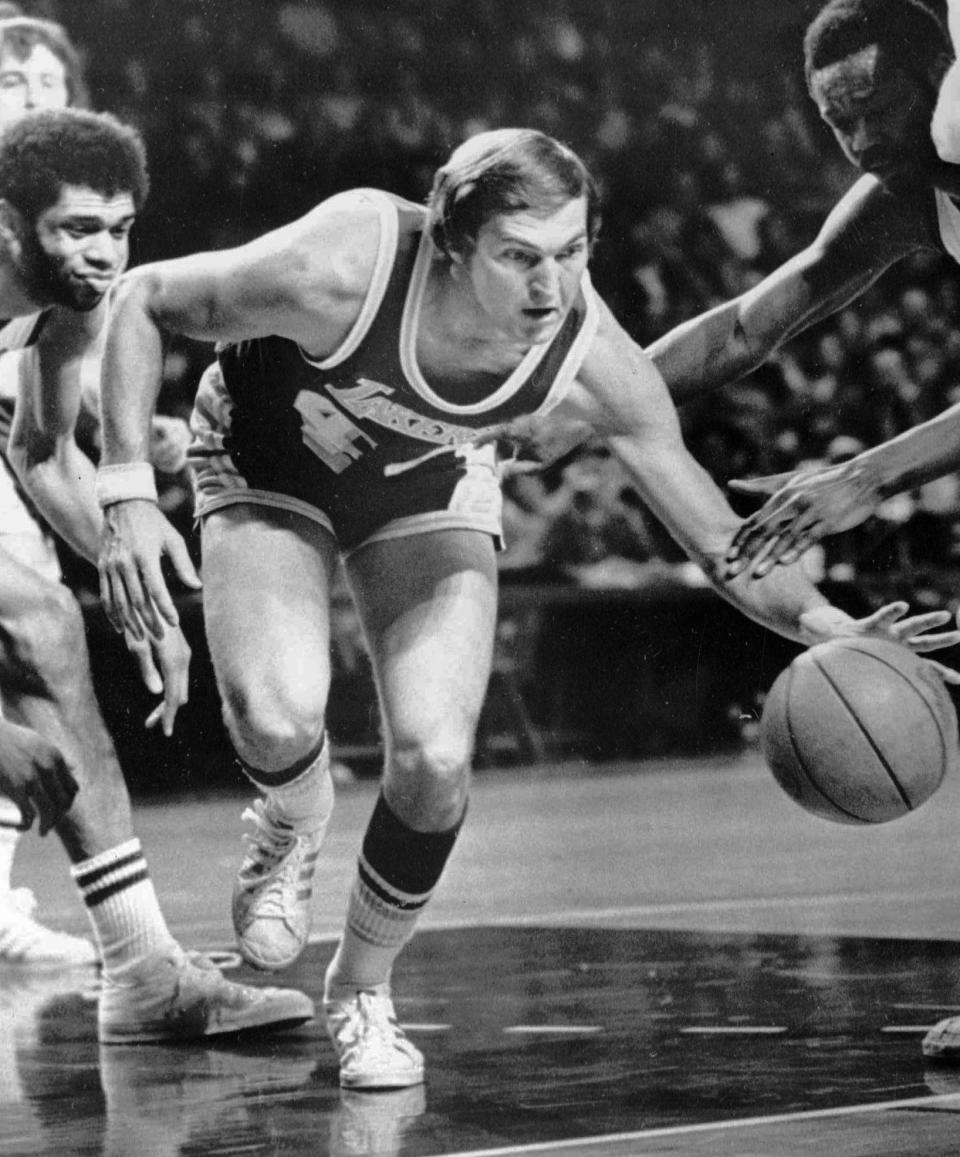 Jerry West cuts through the pack to take charge of a loose ball during  a 94-90  loss to the Milwaukee Bucks on Jan.20, 1974.