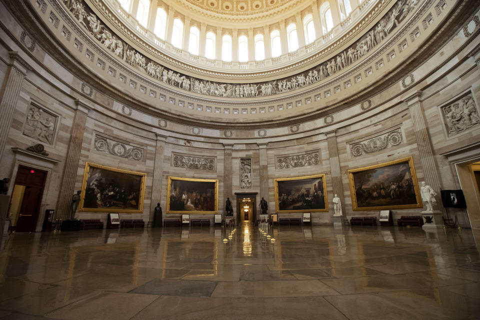 The empty U.S. Capitol Rotunda is seen during a partial government shutdown in Washington, Monday, Dec. 24, 2018. Both sides in the long-running fight over funding President Donald Trump's U.S.-Mexico border wall appear to have moved toward each other, but a shutdown of one-fourth of the federal government entered Christmas without a clear resolution in sight. (AP Photo/Manuel Balce Ceneta)