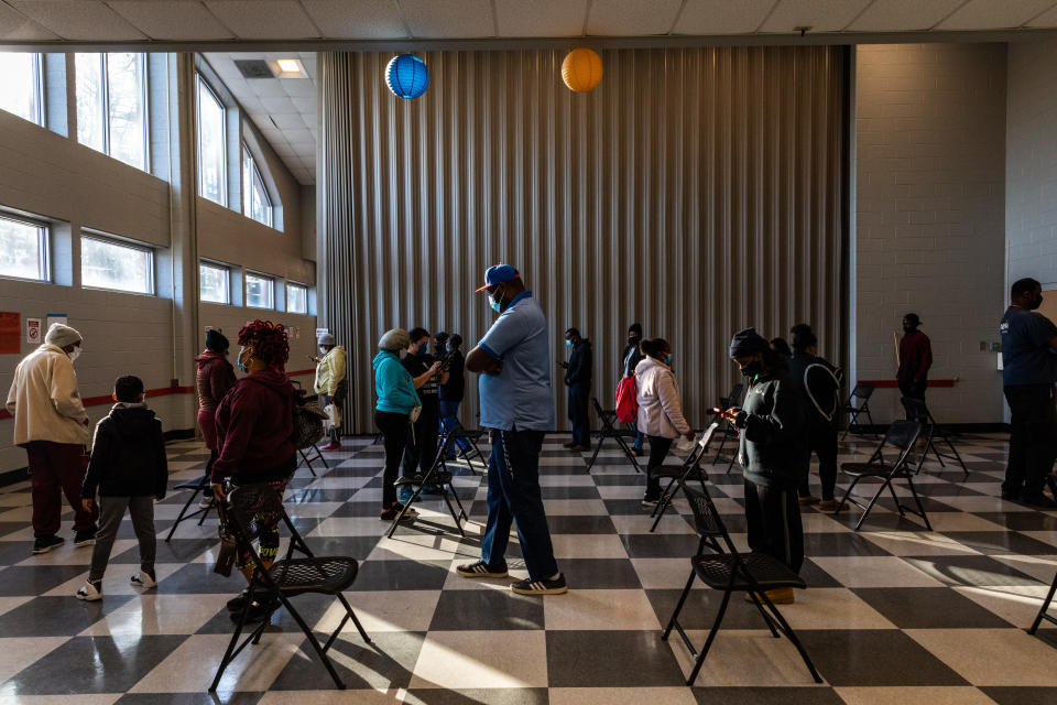 Voters stand in line to cast ballots 