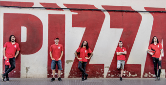 Crisix, who say pizza is in their DNA, pose as pizza guys for 'The Pizza EP.' (Credit: Victor Gómez)