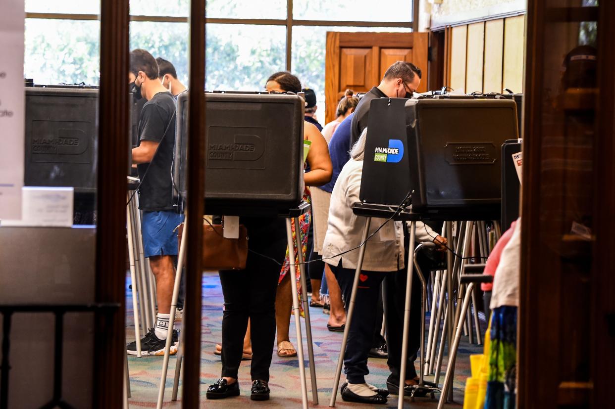 Voters cast their early ballots at the Coral Gables Branch Library in Miami (AFP via Getty Images)