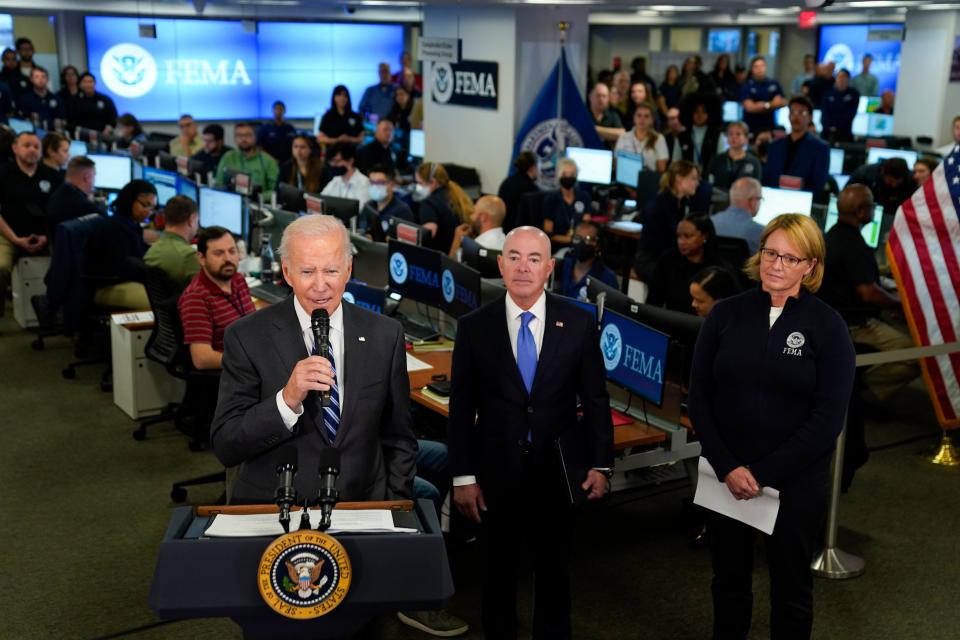 President Joe Biden speaks about Hurricane Ian during a visit to FEMA headquarters, Thursday, Sept. 29, 2022, in Washington. FEMA Administrator Deanne Criswell and Homeland Security Secretary Alejandro Mayorkas look on. (AP Photo/Evan Vucci) ORG XMIT: DCEV410