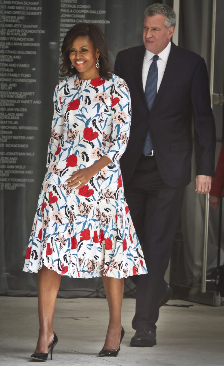 First Lady Michelle Obama arrives at a Whitney Museum event in 2015 wearing a printed dress by Thakoon. (AP Photo/Bebeto Matthews)