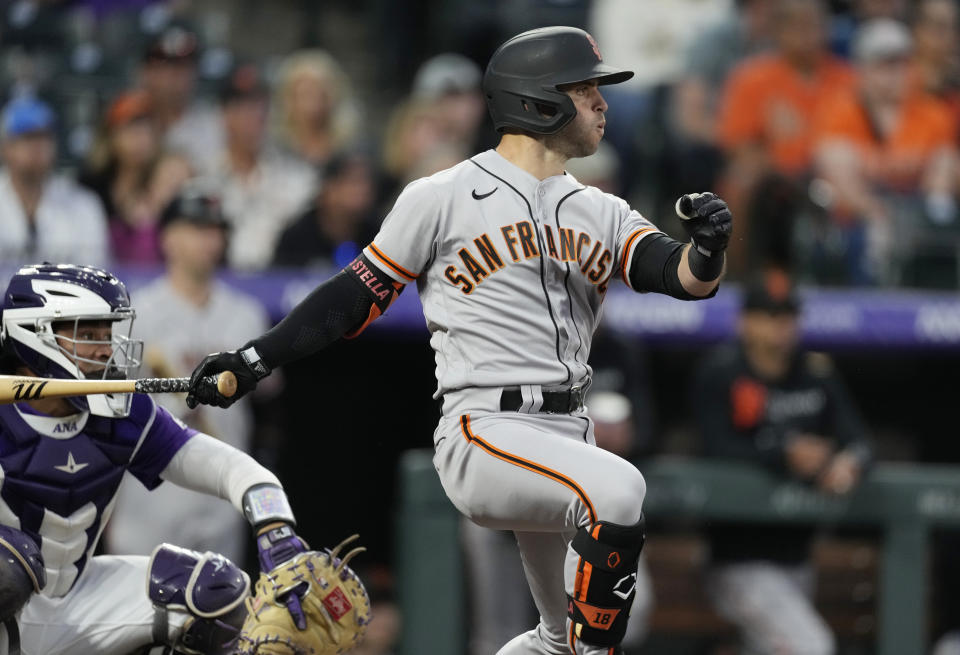 San Francisco Giants' Tommy La Stella singles off Colorado Rockies starting pitcher Peter Lambert in the third inning of a baseball game Friday, Sept. 24, 2021, in Denver. (AP Photo/David Zalubowski)