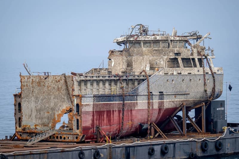 The salvaged stern of the sunken freighter "Verity", which was split in two, lies on a platform. On October 24, 2023, the "Verity" and the freighter "Polesie" collided southwest of Heligoland and "Verity" was sank. The salvage of the sunken "Verity" has now been delayed. Sina Schuldt/dpa