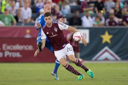 Oct 10, 2015; Commerce City, CO, USA; Colorado Rapids defender Joseph Greenspan (20) battles with Montreal Impact defender Laurent Ciman (23) for the ball in the second half at Dick's Sporting Goods Park. The Impact defeated the Rapids 1-0. Mandatory Credit: Isaiah J. Downing-USA TODAY Sports