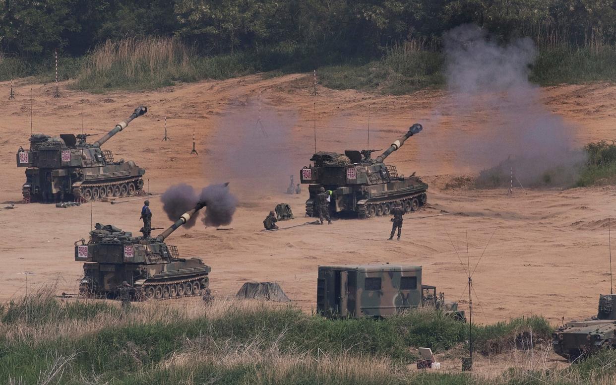 South Korean army's K-55 self-propelled howitzers fire during the annual exercise in Paju, near the border with North Korea on Monday, May 22. South Korea's military said Tuesday, May 23, 2017, it fired warning shots at an unidentified object flying south from rival North Korea - Yonhap