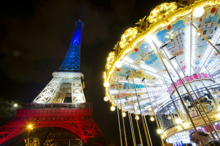 The Eiffel Tower is illuminated with the colours of the French national flag in tribute to the victims of the November 13 Paris terror attacks