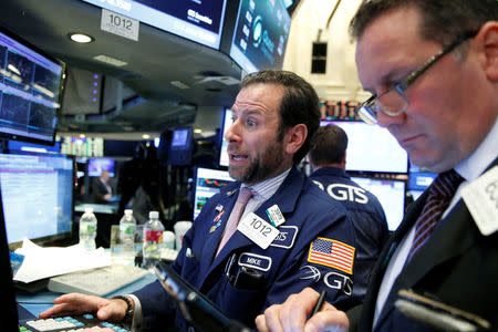 Traders work on the floor of the New York Stock Exchange (NYSE) in New York City, U.S., November 14, 2016. REUTERS/Brendan McDermid