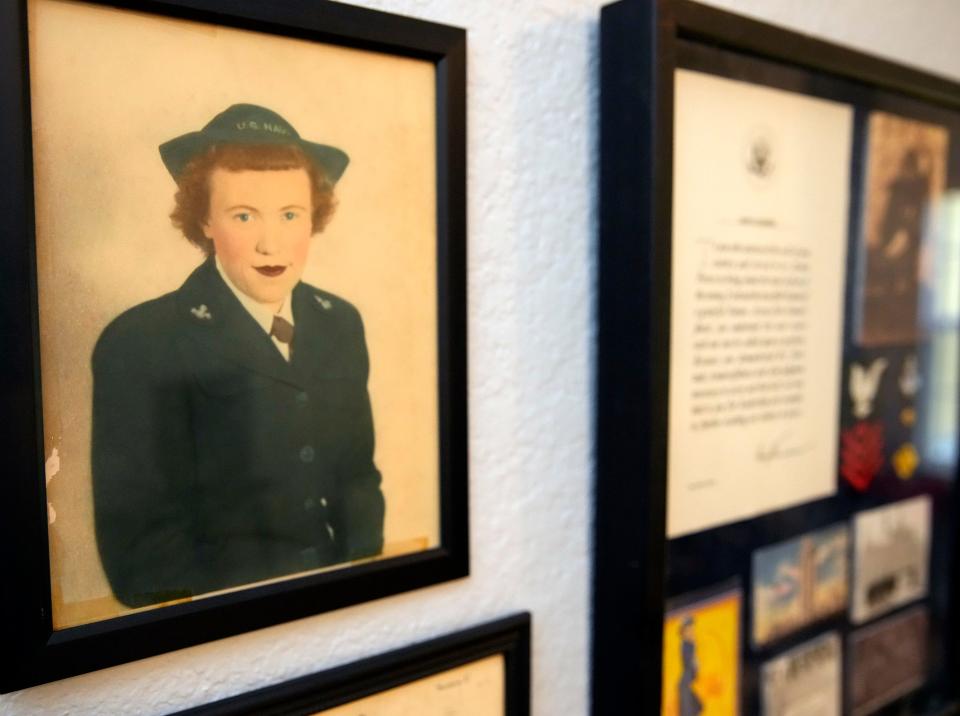 Mementos of Mary German's military service during World War II line a wall in her apartment. German's recent 100th birthday will be celebrated with a dance on Friday at VFW Post No. 8696 in Palm Coast.