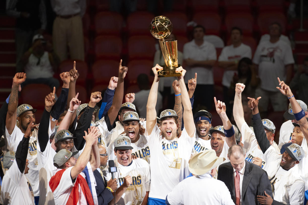 Basketball: NBA Finals: Dallas Mavericks Dirk Nowitzki (41) victorious, holding Larry O'Brien Championship trophy with teammates after winning Game 6 and championship series vs Miami Heat at American Airlines Arena. 
Miami, FL 6/12/2011
CREDIT: Greg Nelson (Photo by Greg Nelson /Sports Illustrated via Getty Images)
(Set Number: X86111 TK1 R11 F306 )