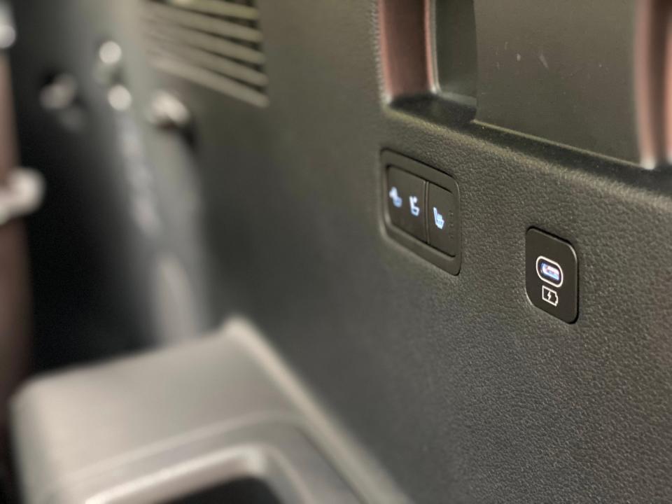 The USB charger and seat controls in the third row of a Hyundai Palisade SUV.