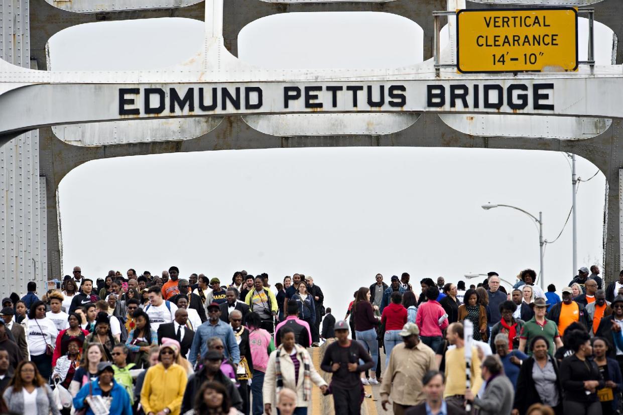 <span class="s1">People crowd the Edmund Pettus Bridge toward Selma, Ala., in 2017 during the annual reenactment of “Bloody Sunday.” (Photo: Albert Cesare/Montgomery Advertiser via AP)</span>