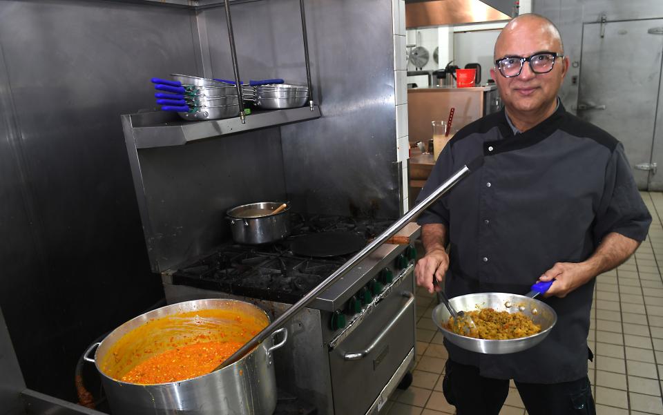 The restaurant Garlic & Ginger: Fine Indian Cuisine by Chef AK recently opened in Spartanburg. This is Chef Arun Kakkar preparing meals for guests.