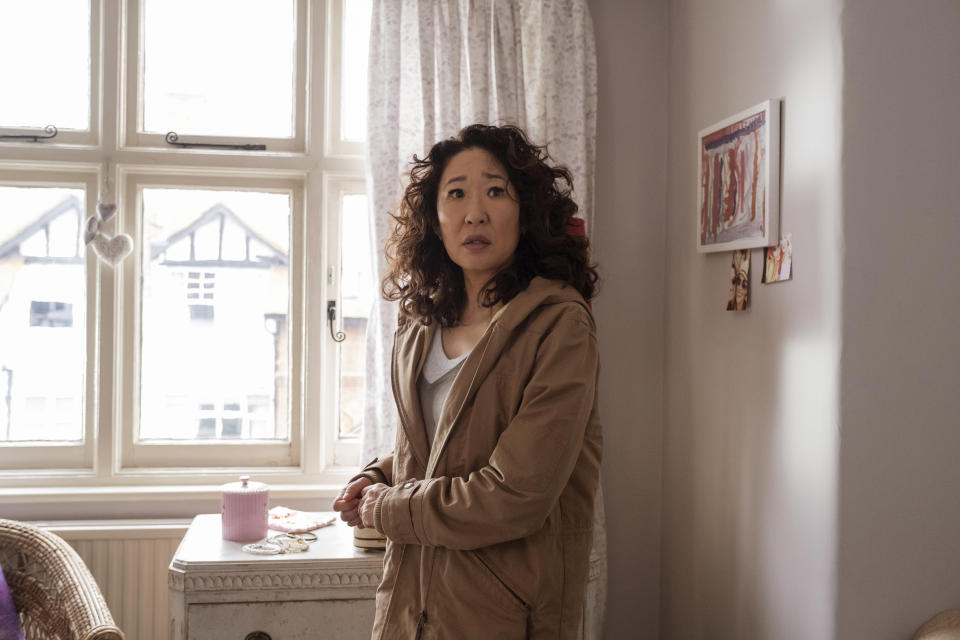 This image released by BBC America shows Sandra Oh in a scene from "Killing Eve:" On Monday, Dec. 9, 2019, "Killing Eve" was nominated for a Golden Globe for best drama series. (Nick Wall/BBCAmerica via AP)