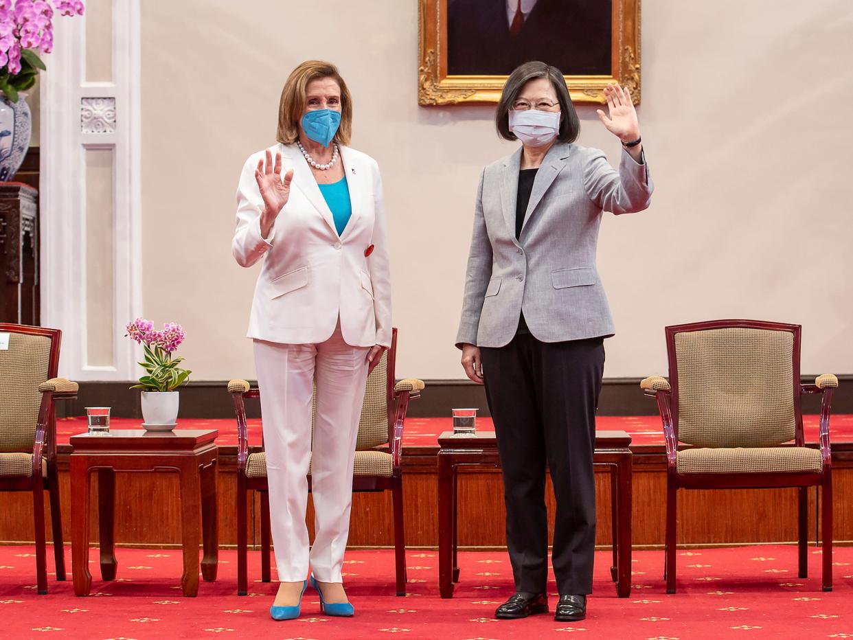 US House Speaker Nancy Pelosi, left, and Taiwanese President President Tsai Ing-wen wave during a meeting in Taipei, Taiwan, Wednesday, Aug. 3, 2022.