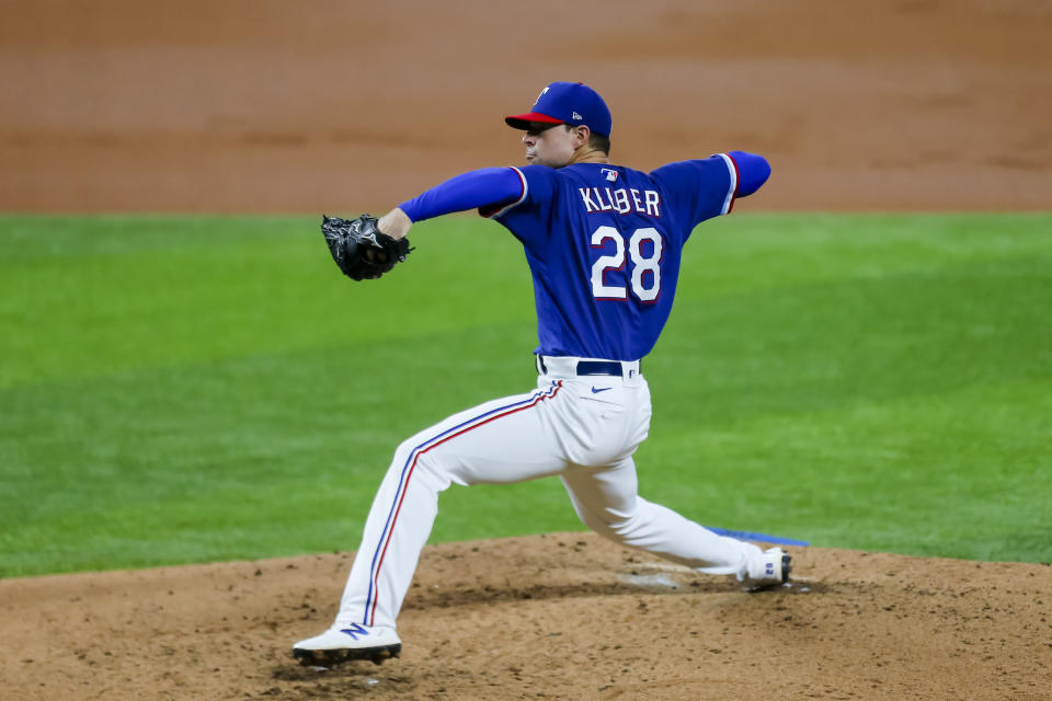 ARLINGTON, TX - JULY 04: Texas Rangers starting pitcher Corey Kluber (28) winds up and pitches during day 2 of summer camp workouts for the Texas Rangers on July 04, 2020 at Globe Life Field in Arlington, TX. (Photo by Matthew Pearce/Icon Sportswire via Getty Images)