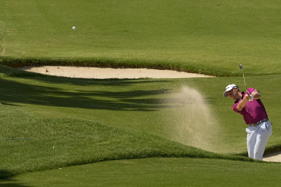 Justin Thomas hits from the bunker on the ninth hole during the first round of the PGA Championship golf tournament at Southern Hills Country Club, Thursday, May 19, 2022, in Tulsa, Okla. (AP Photo/Matt York)