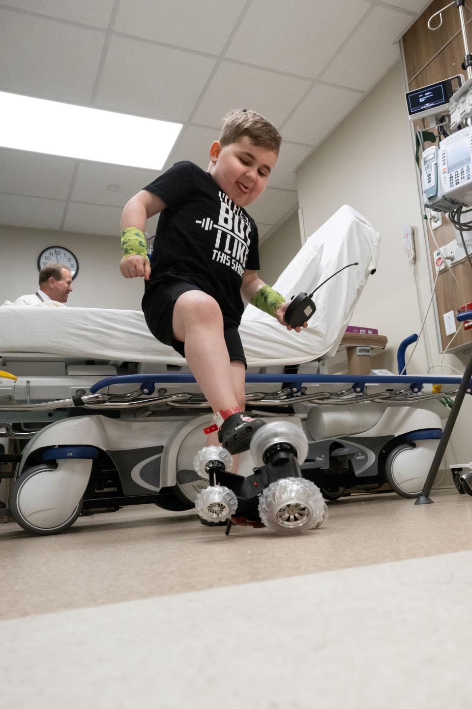Six-year-old Vinny DeMando plays while waiting for his treatment at Akron Children's Hospital.