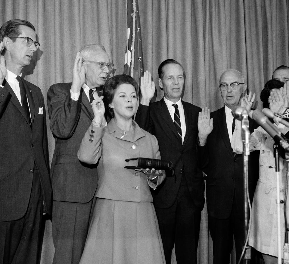 In this Sept. 16, 1969, file photo, former child star Shirley Temple Black raises her hand as she is sworn in as a representative in the U.S. delegation to the 24th regular session of the United Nations General Assembly which opened, in New York. Temple, who died at her home near San Francisco, Monday, Feb. 10, 2014, at 85, sang, danced, sobbed and grinned her way into the hearts of Depression-era moviegoers and remains the ultimate child star decades later. (AP Photo/Anthony Camerano, File)