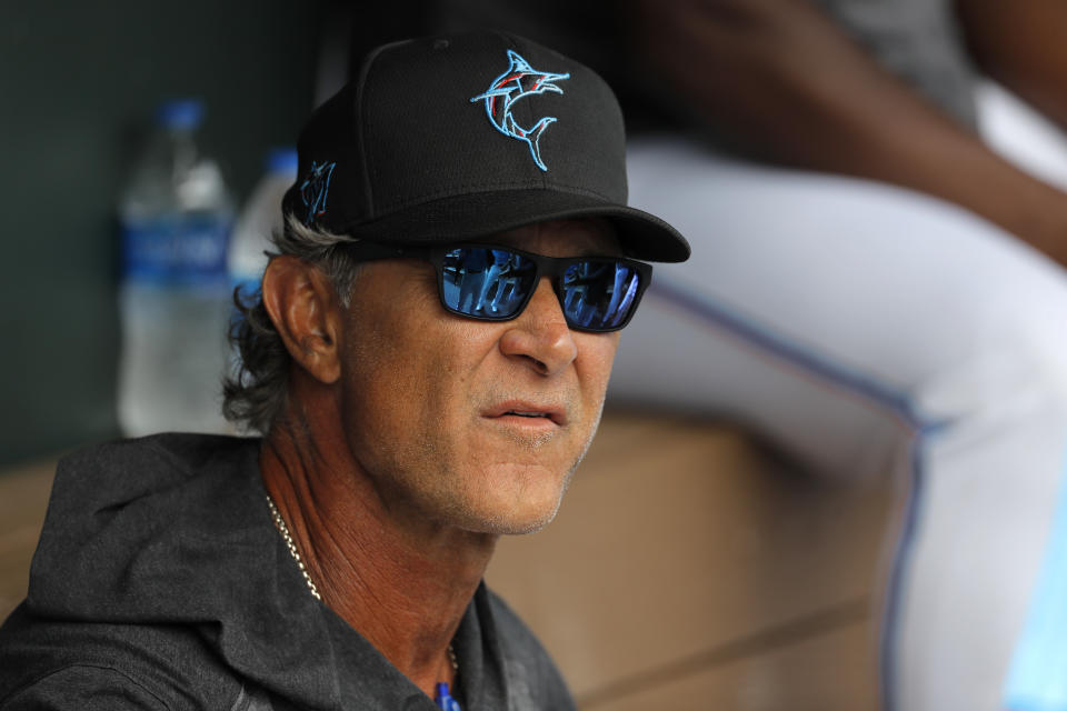 FILE - Miami Marlins manager Don Mattingly looks on from the dugout prior to a spring training baseball game against the Washington Nationals in Jupiter, Fla., in this Tuesday, March 10, 2020, file photo. Mattingly's job remains to develop young talent so an underfinanced team can overachieve. He considers his ability to relate to players one of his strengths, perhaps because he was an overachiever himself. (AP Photo/Julio Cortez, File)