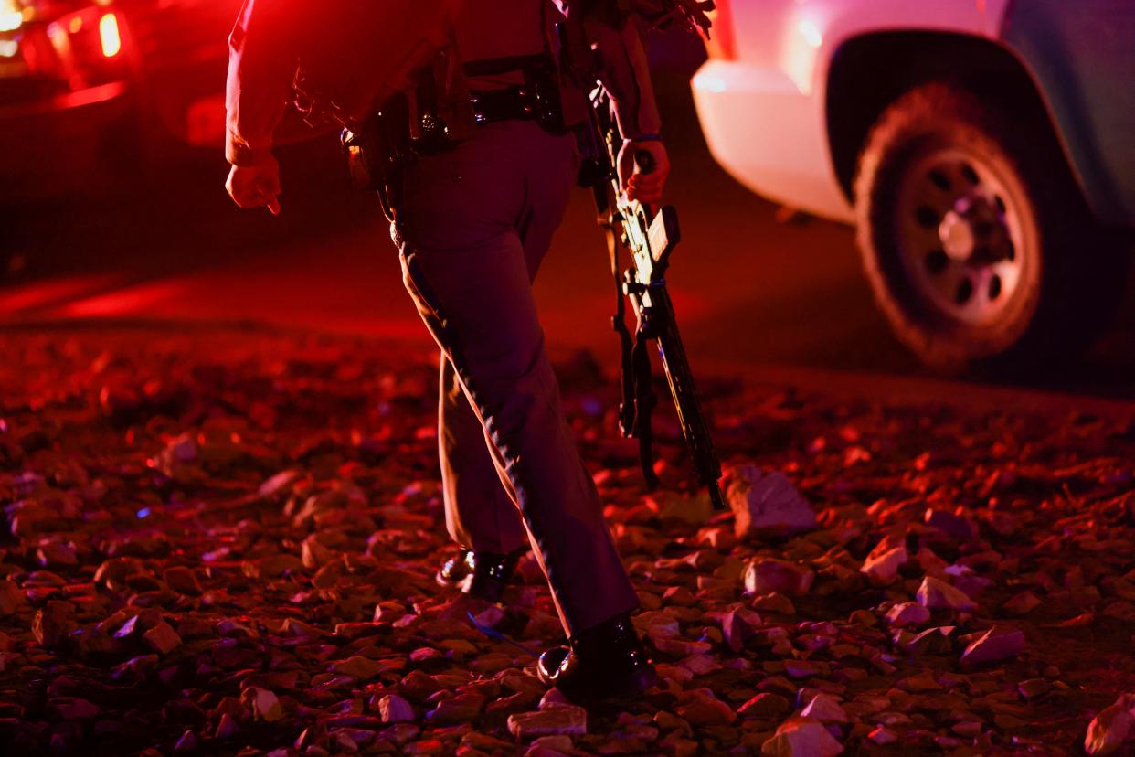 A law enforcement member walks outside the Cielo Vista Mall after a shooting, in El Paso, Texas, U.S February 15, 2023 (REUTERS)