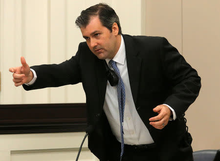 FILE PHOTO: Former North Charleston police officer Michael Slager gestures as he testifies in his murder trial at the Charleston County court in Charleston, South Carolina, November 29, 2016. REUTERS/Grace Beahm/Post and Courier/Pool/File Photo