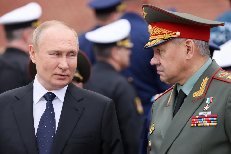 Vladimir Putin with Defence Minister Sergei Shoigu (AP)